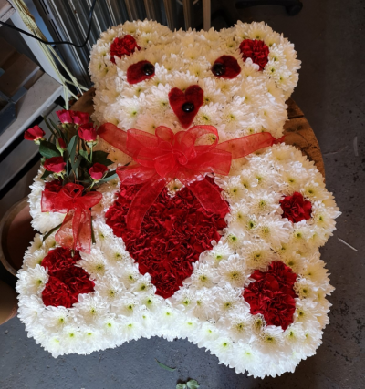 Teddy - At Flower Power we are delighted to offer this teddy in two sizes and your choice of colour for a funeral tribute