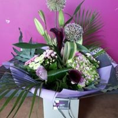 Purple Passion - Ultra modern bouquet handtied and presented in a rope handed gift bag and packed in water for an instant display.

Including seasonal flowers in purples and lilacs.

Available for collection or delivery in the Oswaldtwistle, Accrington, Rishton, Clayton le Moors and surrounding areas of Hyndburn.