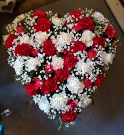 Carnation Heart - At Flower Power @ The Paddock, Oswaldtwistle, we are delighted to offer this stunning carnation heart funeral tribute in your choice of colours. Available for delivery to funeral directors in Oswaldtwistle, Accrington, Blackburn and surrounding areas.