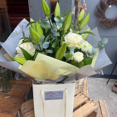 Evelyn - A fabulous collection of white and cream flowers make this the perfect gift. This bouquet will be hand delivered by the local florist.