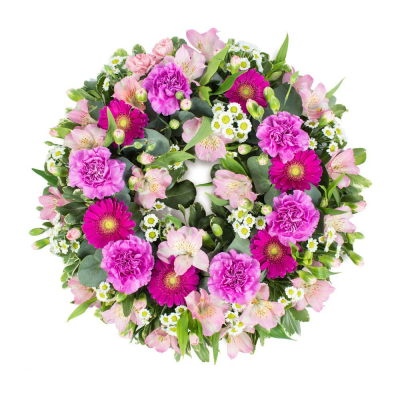 Wreath SYM-320 - A classic wreath in shades of pink finished with fine foliage.
